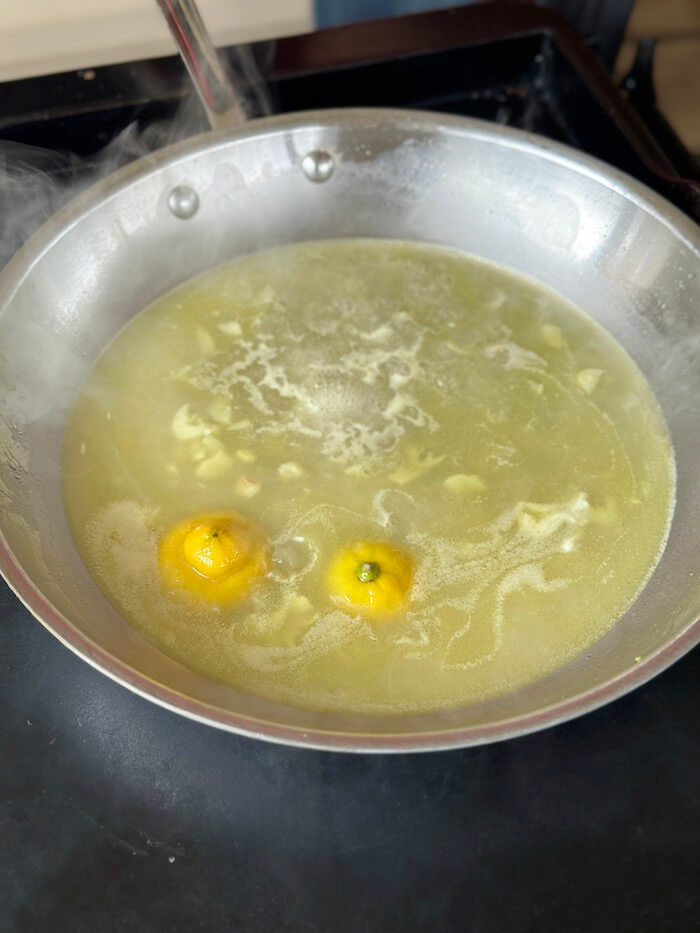 lemon, chicken stock, and garlic in a skillet