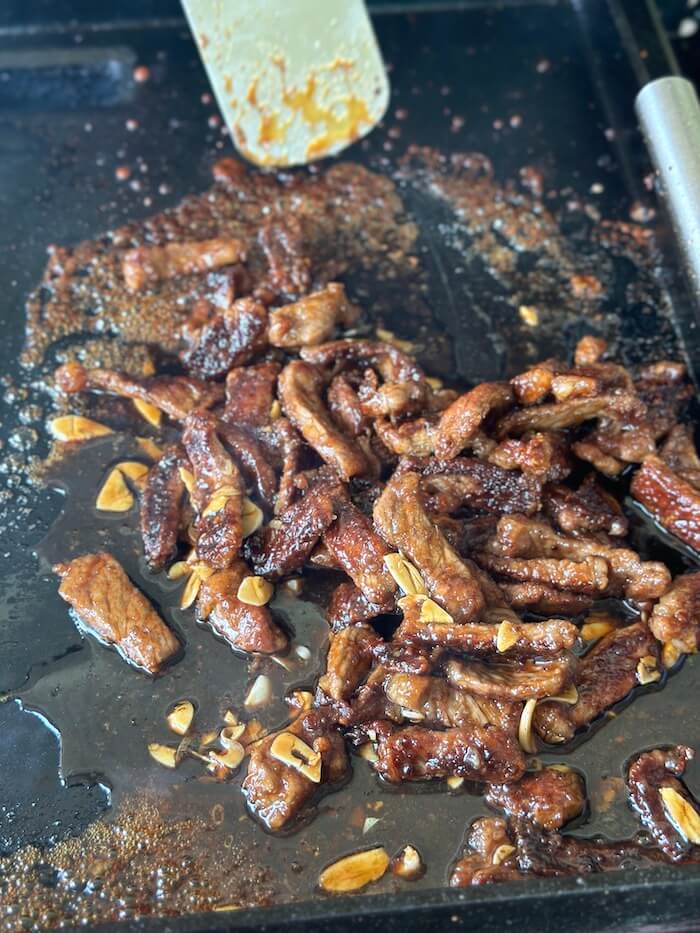 cooking mongolian beef on a griddle