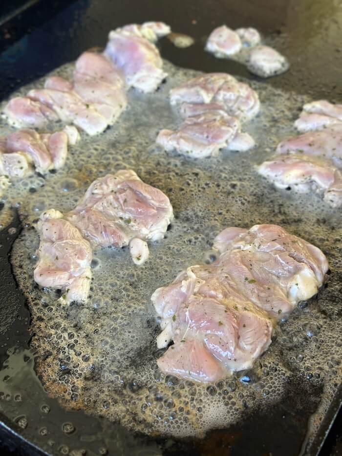 cooking crack chicken on a griddle