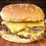 butter burger on a wood cutting board