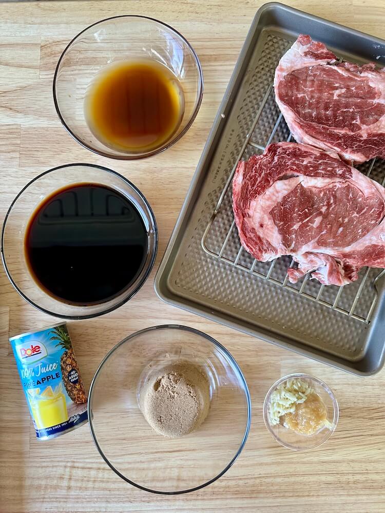 soy sauce, pineapple juice, brown sugar, garlic, and ribeye steaks