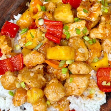 homemade sweet and sour chicken over white rice