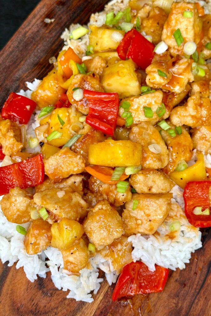 homemade sweet and sour chicken over white rice