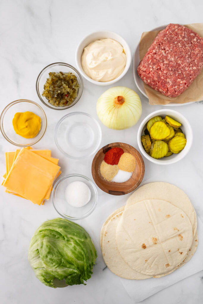 ingredients for big mac smash burger tacos portioned out in bowls