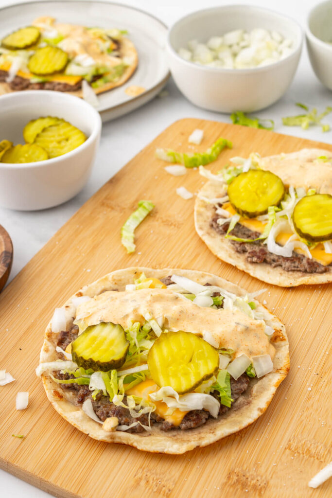 smashed burger tacos on a cutting board