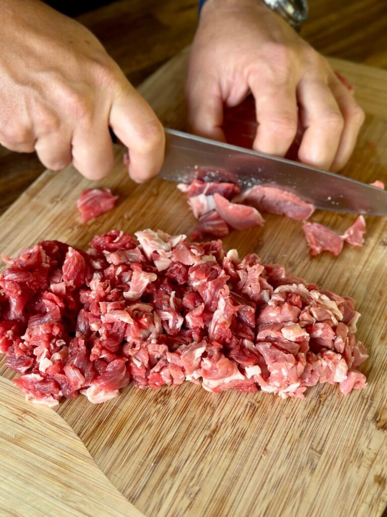 cutting steak for cheesesteak