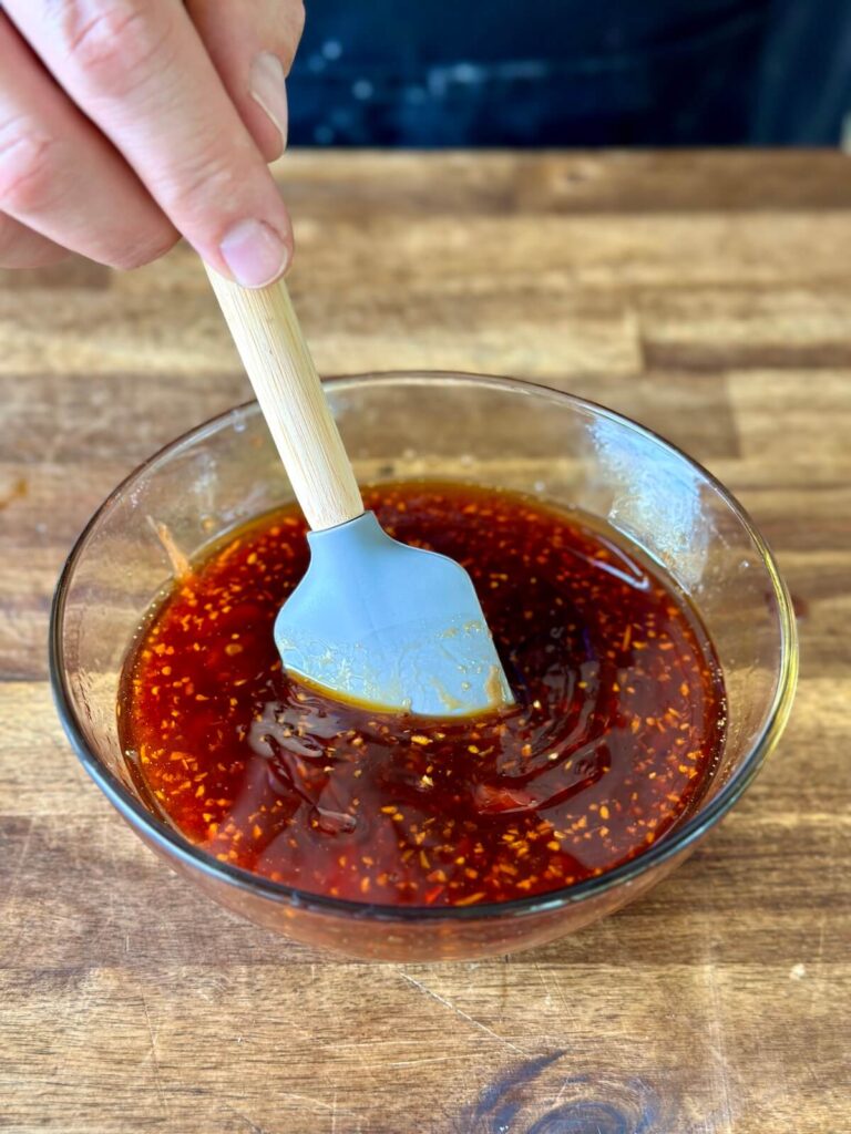 mixing sauce for sesame chicken in a bowl