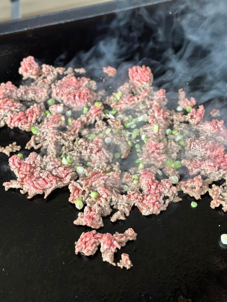 cooking ground beef on a griddle