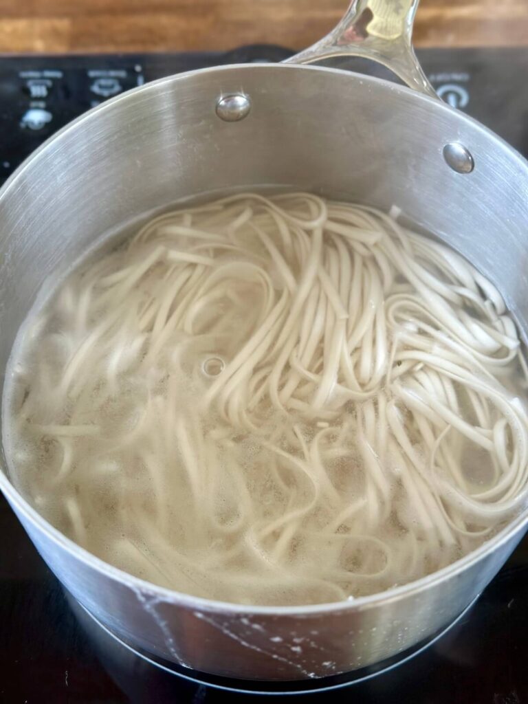 cooking noodles in a pot