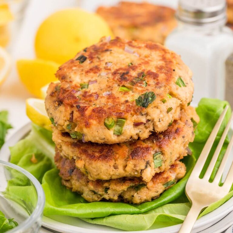 salmon patties stacked on a plate