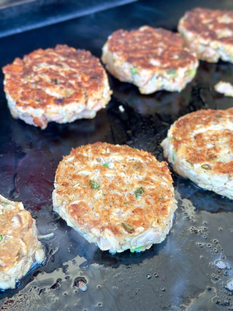 cooking salmon patties on a griddle
