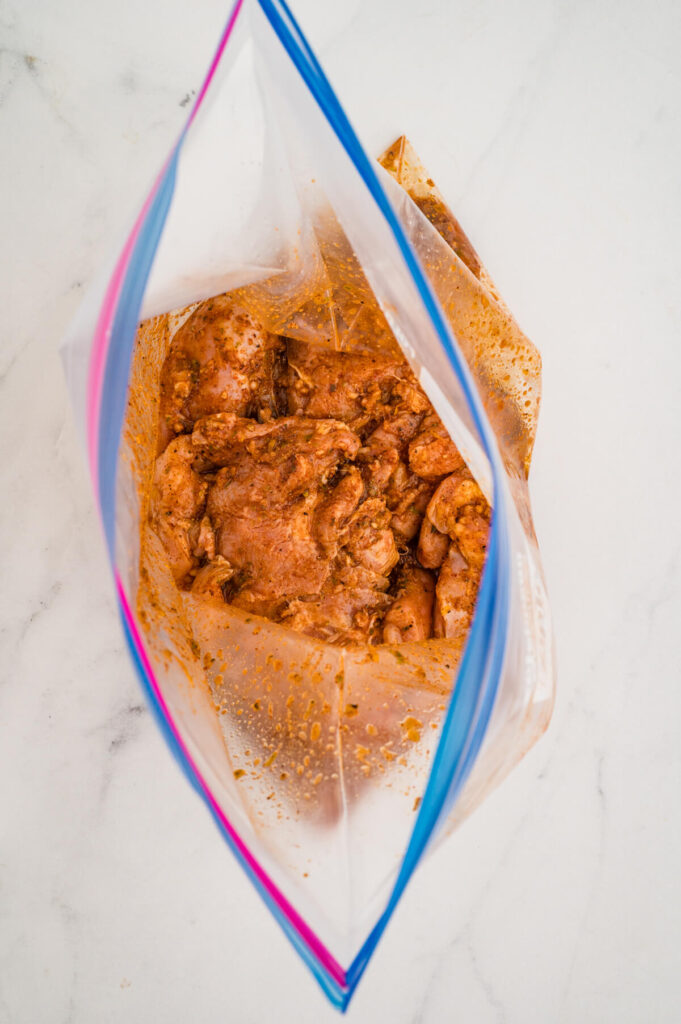 marinating chicken thighs in a Mexican street taco marinade