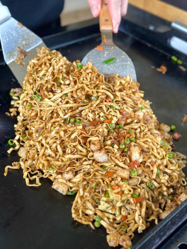 stirring noodle stir fry with shrimp