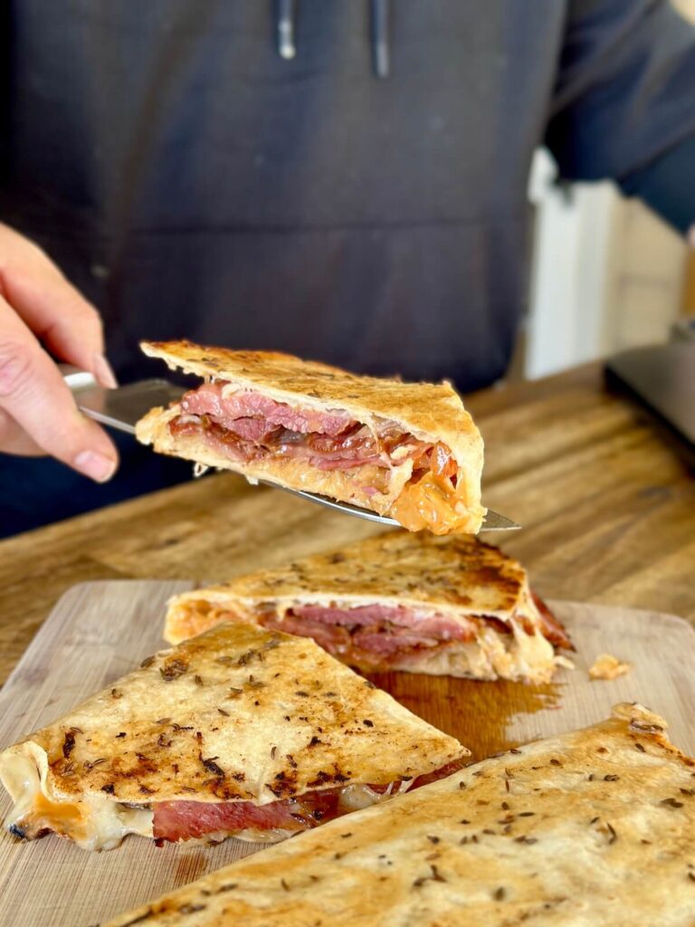 a slice of reuben quesadilla