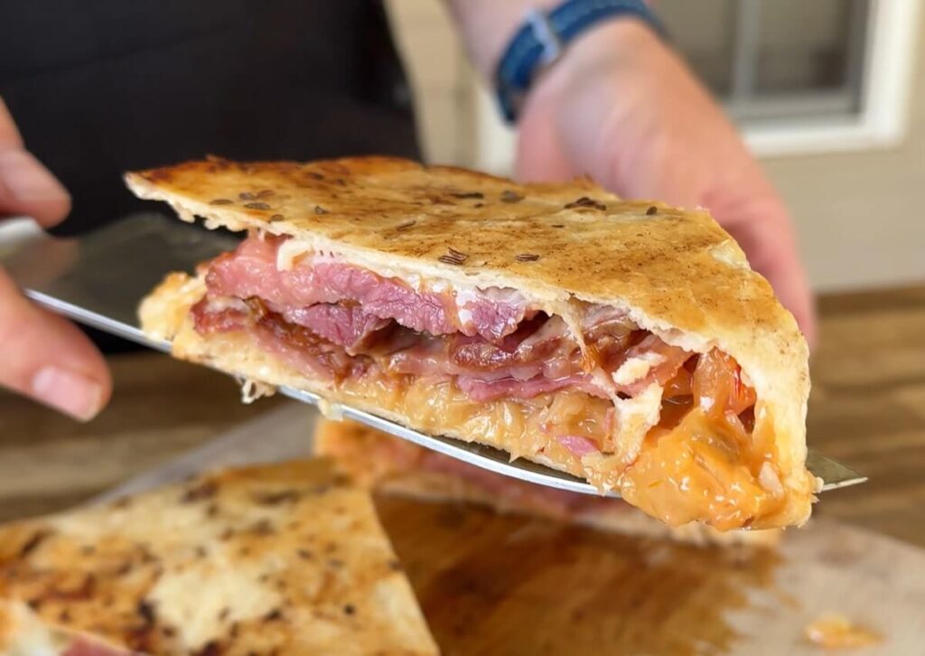 quesadilla with corned beef sliced into triangles