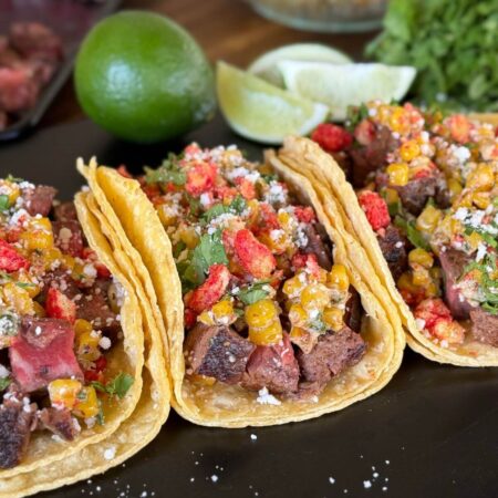 steak and corn elotes tacos