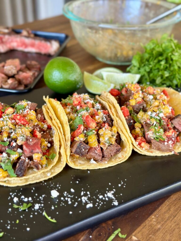steak and corn elotes tacos