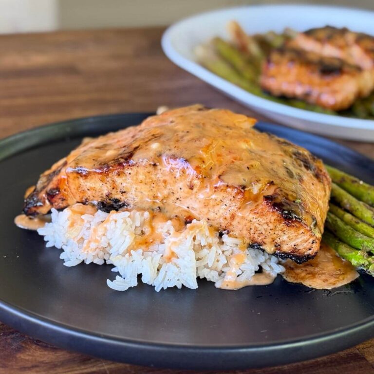 bang bang salmon with white rice and asparagus