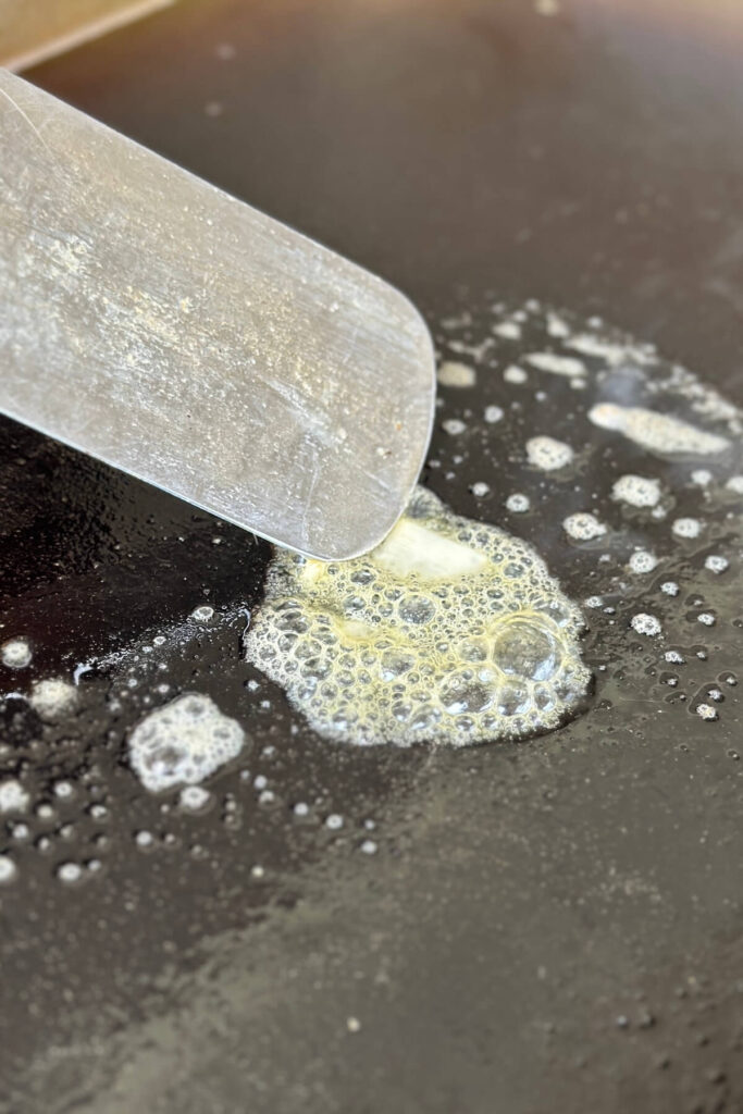 melting butter on a Blackstone griddle
