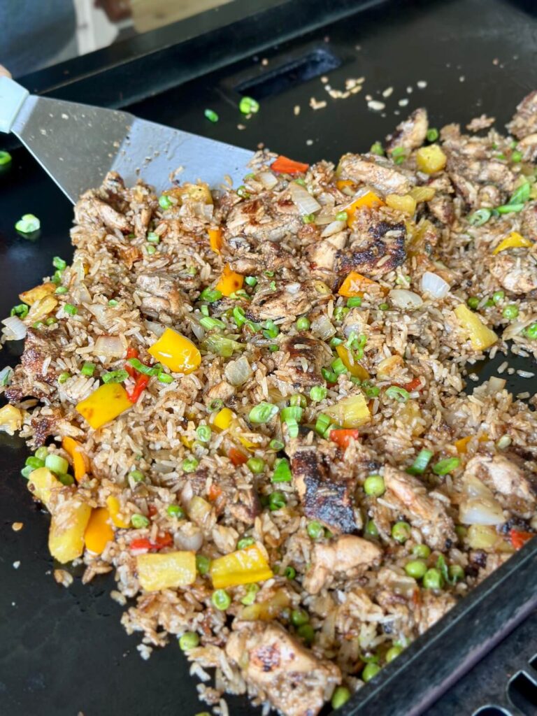 coconut Jamaican jerk chicken fried rice on a griddle