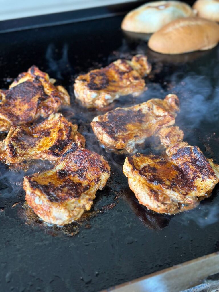 cooking Mexican chicken on a griddle