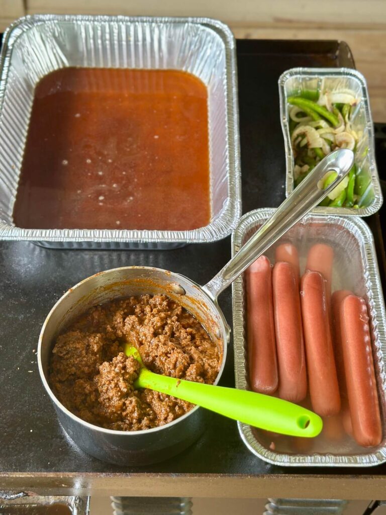 warming station on a griddle with aluminum foil pans