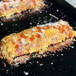 hash brown omelette with chorizo cooking on a Blackstone griddle