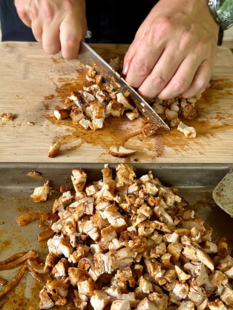 cutting chicken into bite-sized pieces