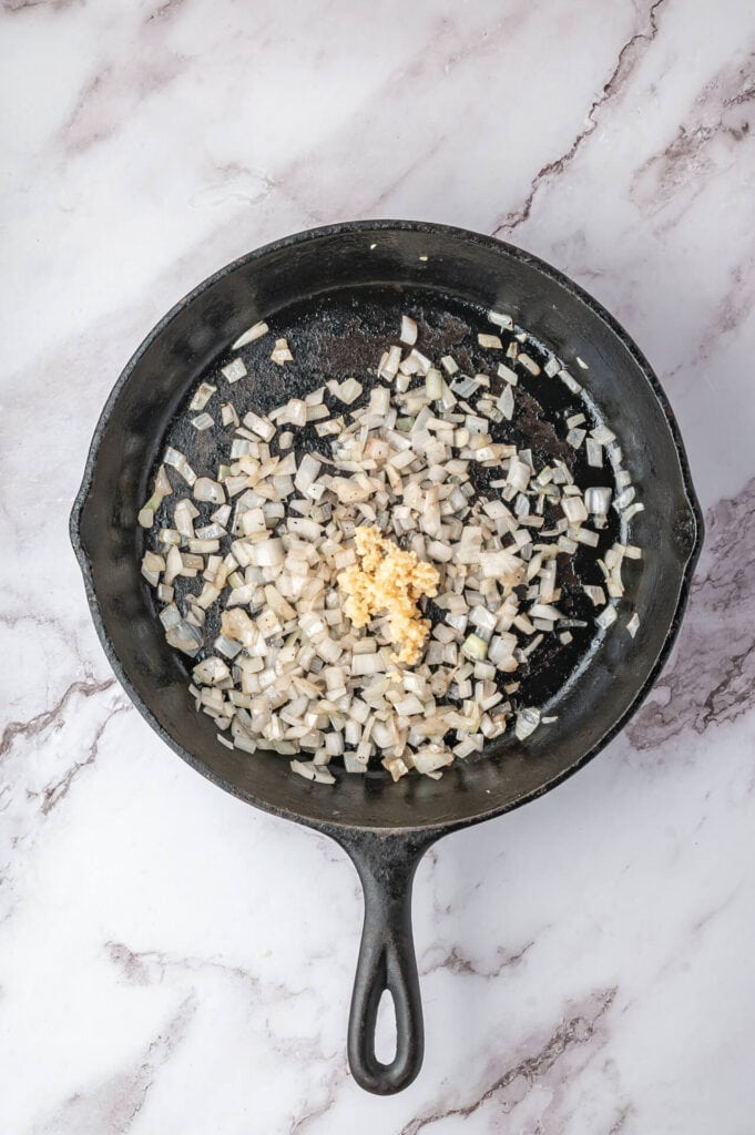 sautéing onions and garlic in a skillet