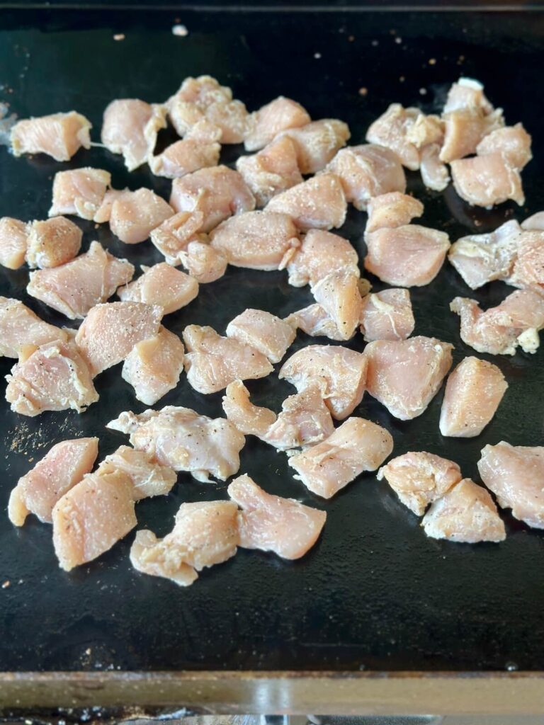 cooking chicken bites on a Blackstone griddle