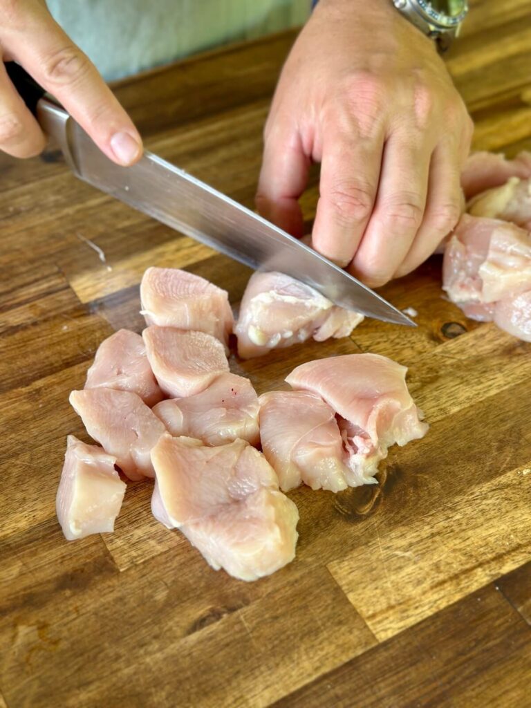 cutting boneless skinless chicken breasts into pieces