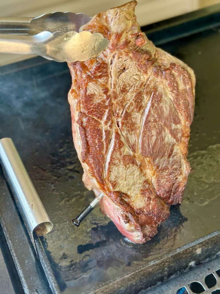 searing a chuck roast on a griddle