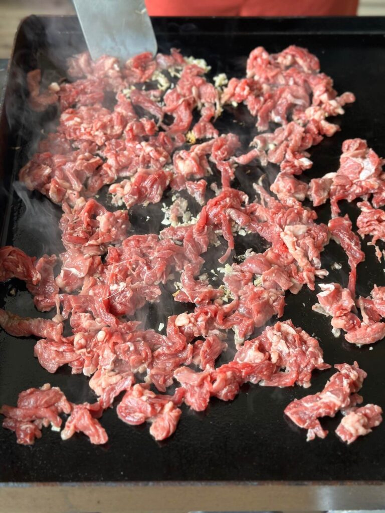 cooking slices of beef