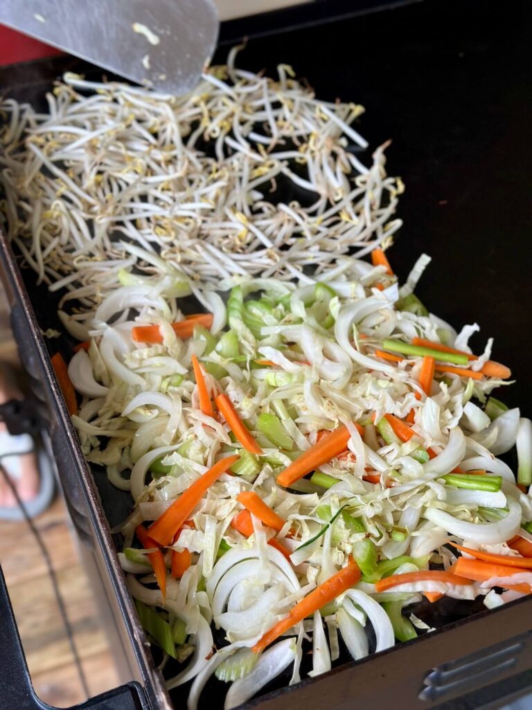 sautéing vegetables for chow mein