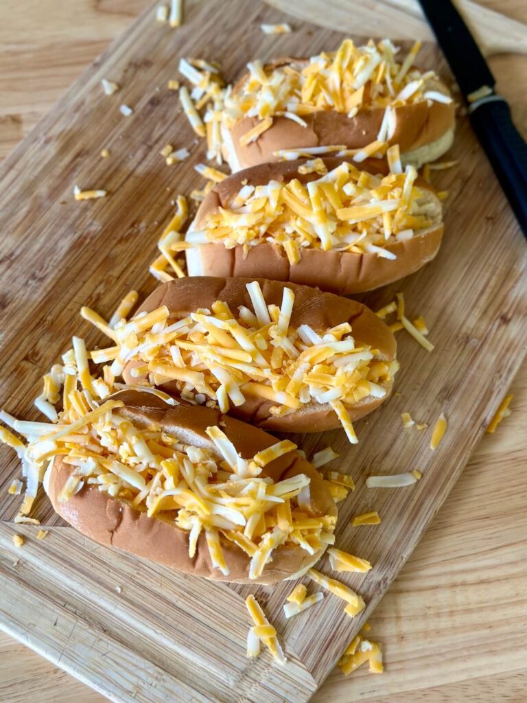shredded cheese stuffed inside hot dog buns