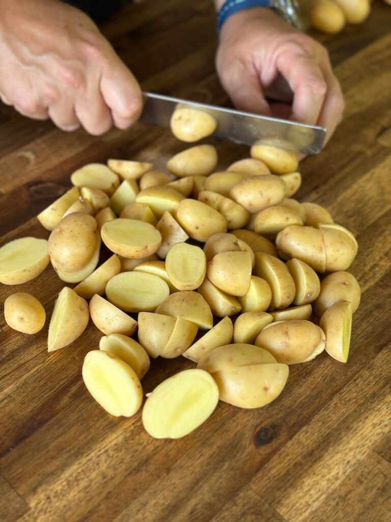 cutting baby yellow potatoes