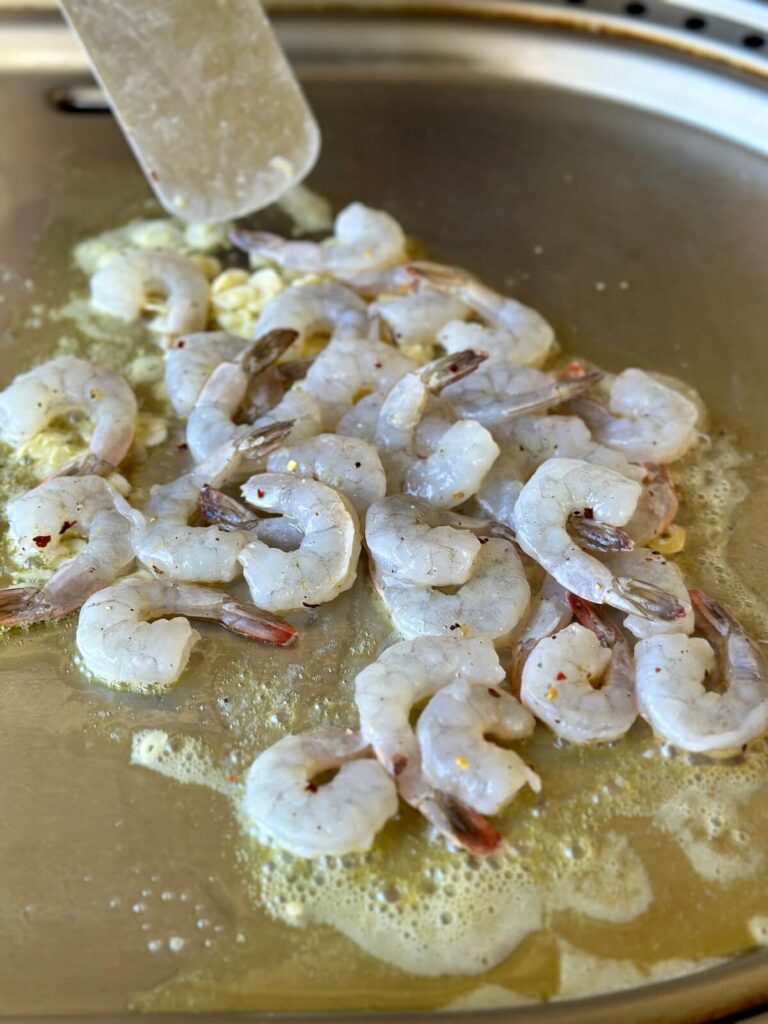 sautéing raw shrimp in butter and garlic