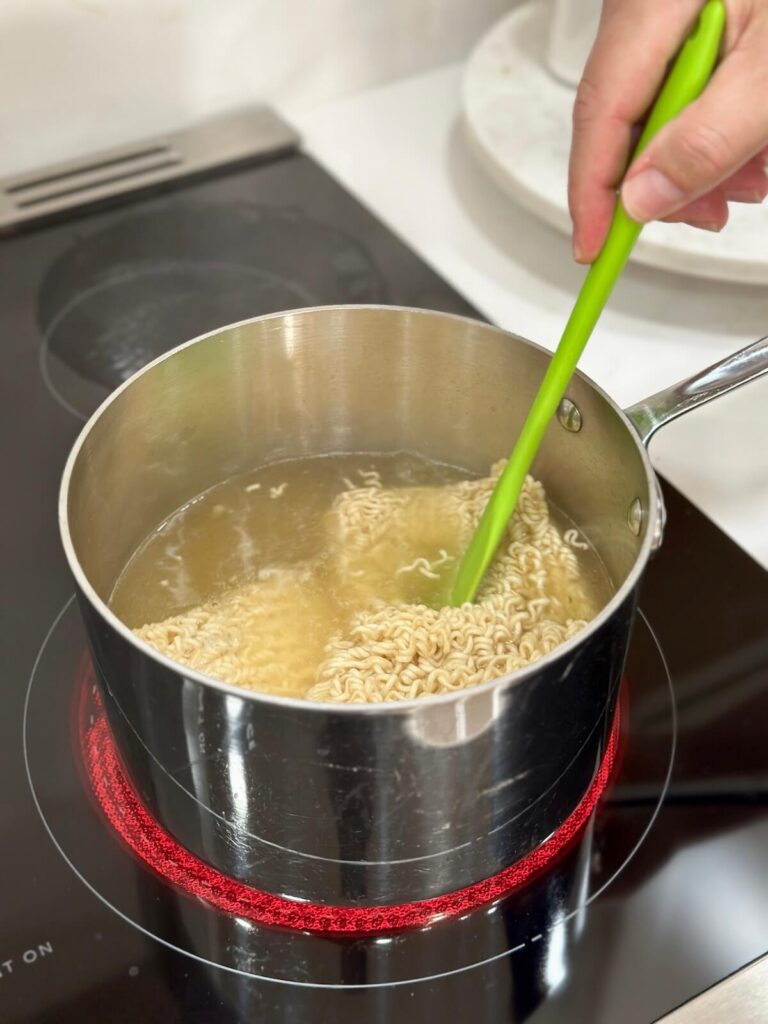 cooking ramen noodles in boiling water