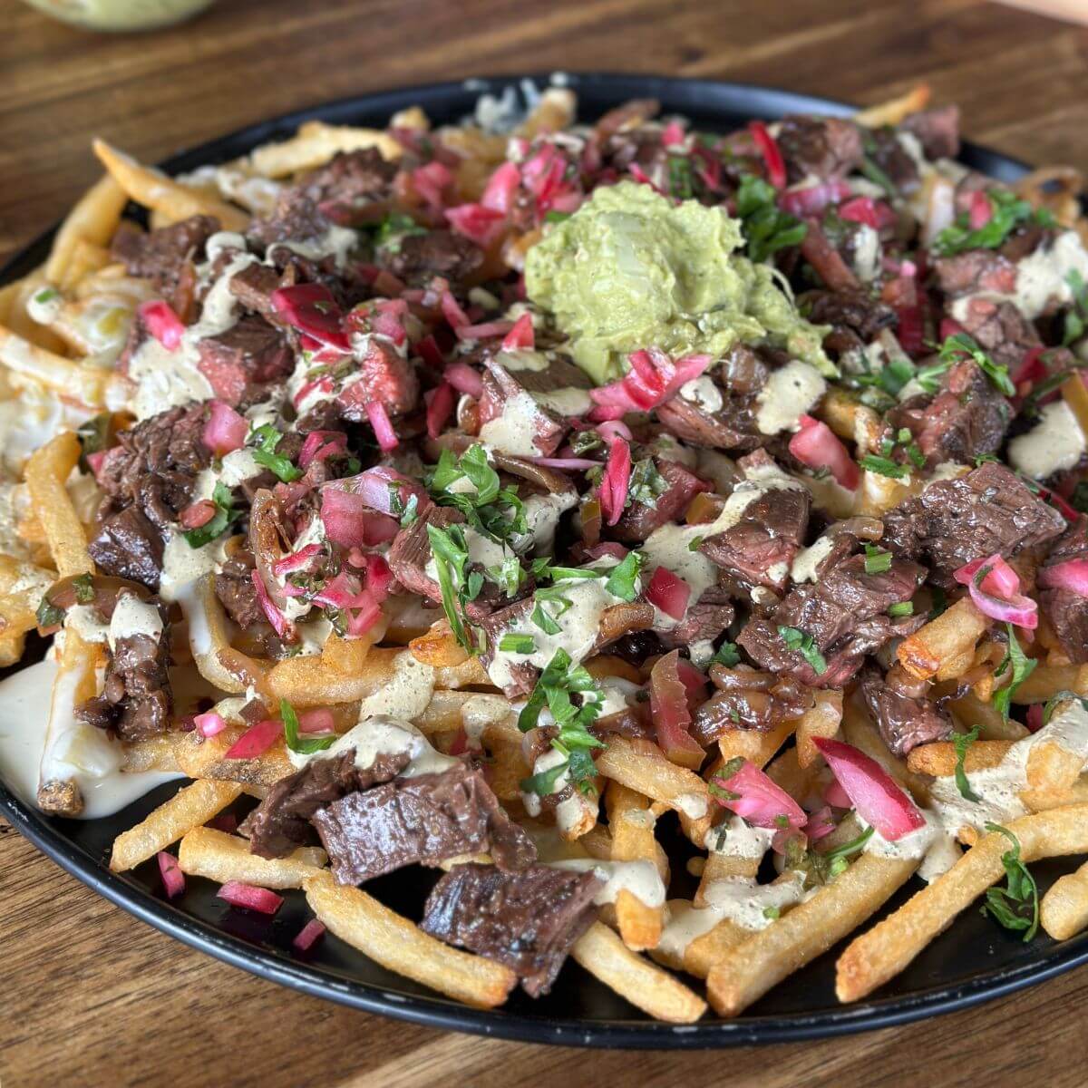 carne asada fries with white queso