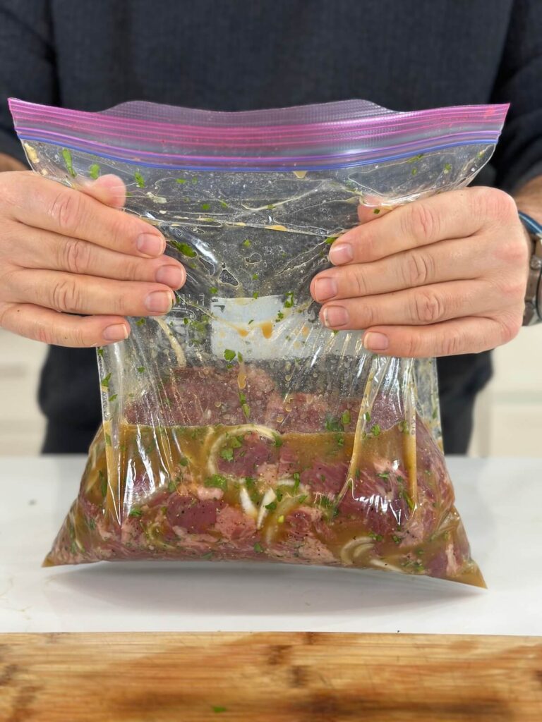 marinating skirt steak in a carne asada marinade