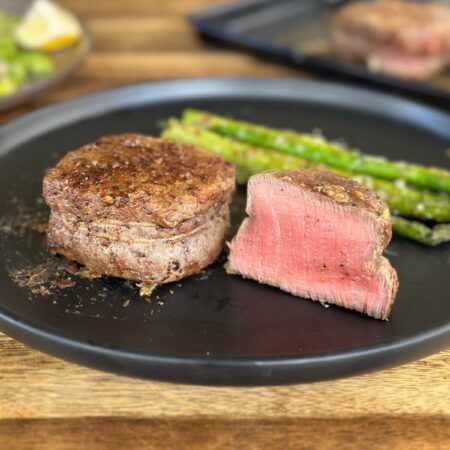 filet mignon cut in half on a plate