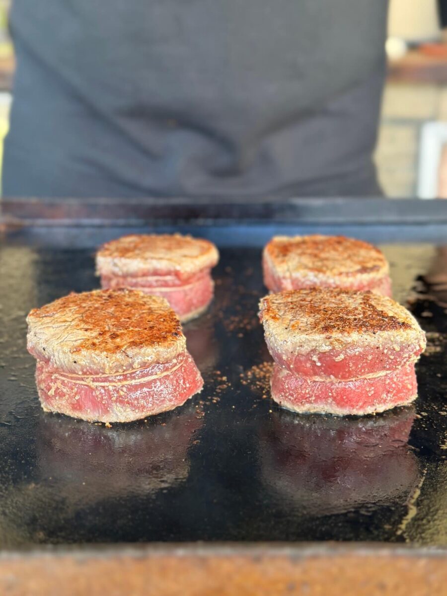 searing filet mignon on a Blackstone griddle