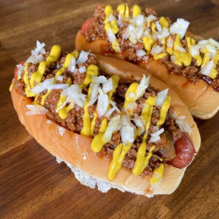 chili dogs with hot dog chili sauce, mustard, and diced onions
