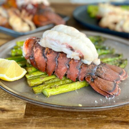 lobster tails on Blackstone served with asparagus