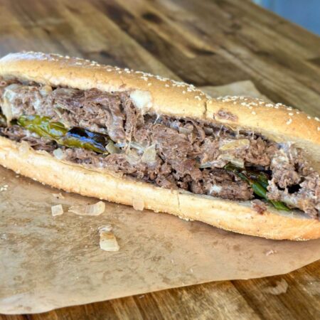 cheesesteak with shaved ribeye and roasted long hot peppers
