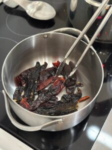 dry toasting dried chile peppers in a large pot