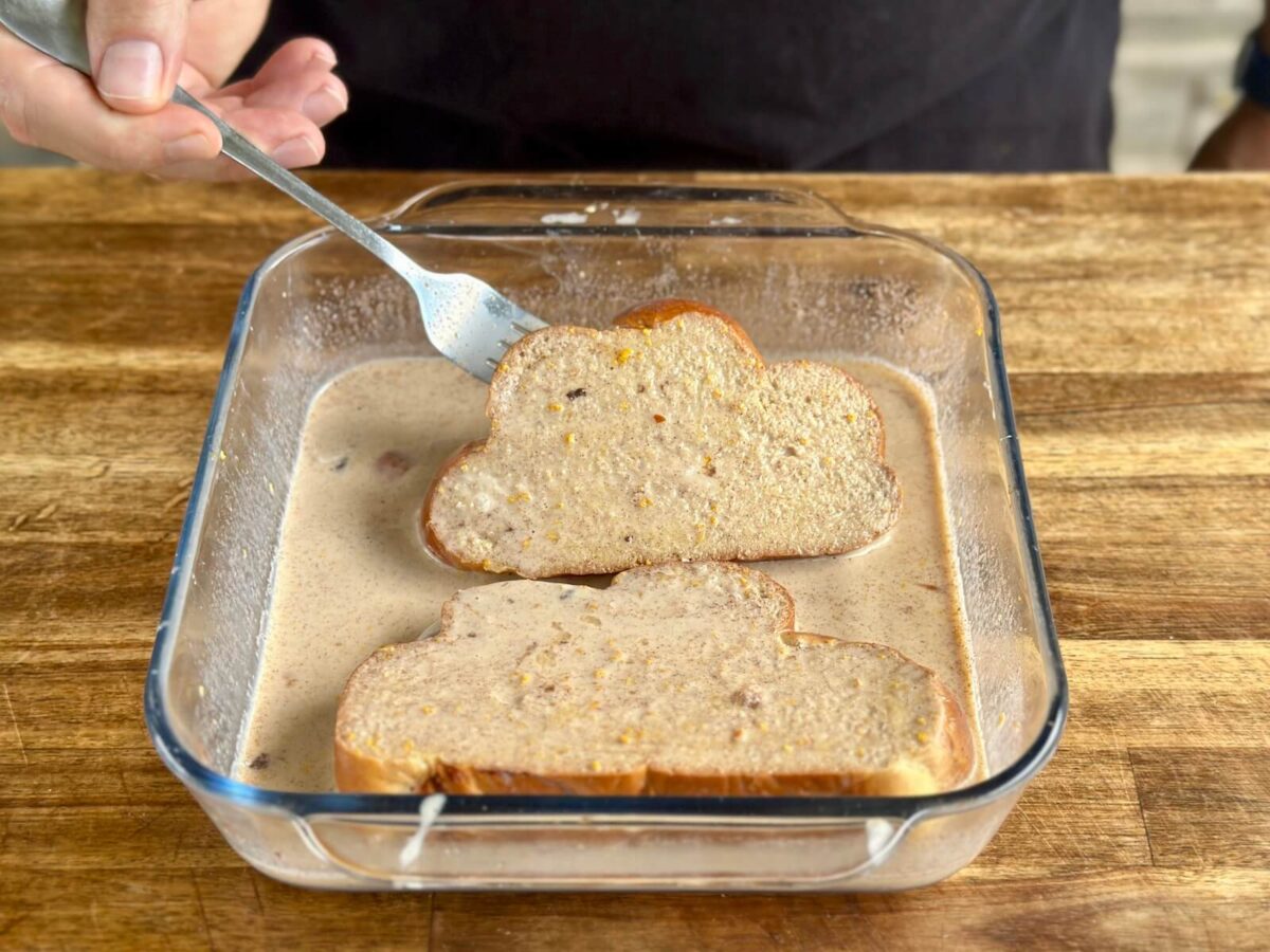 soaking thick bread slices in a French toast custard