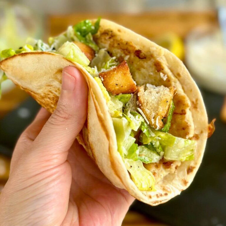 chicken Caesar smash taco with chicken, lettuce, croutons and Caesar dressing in a tortilla
