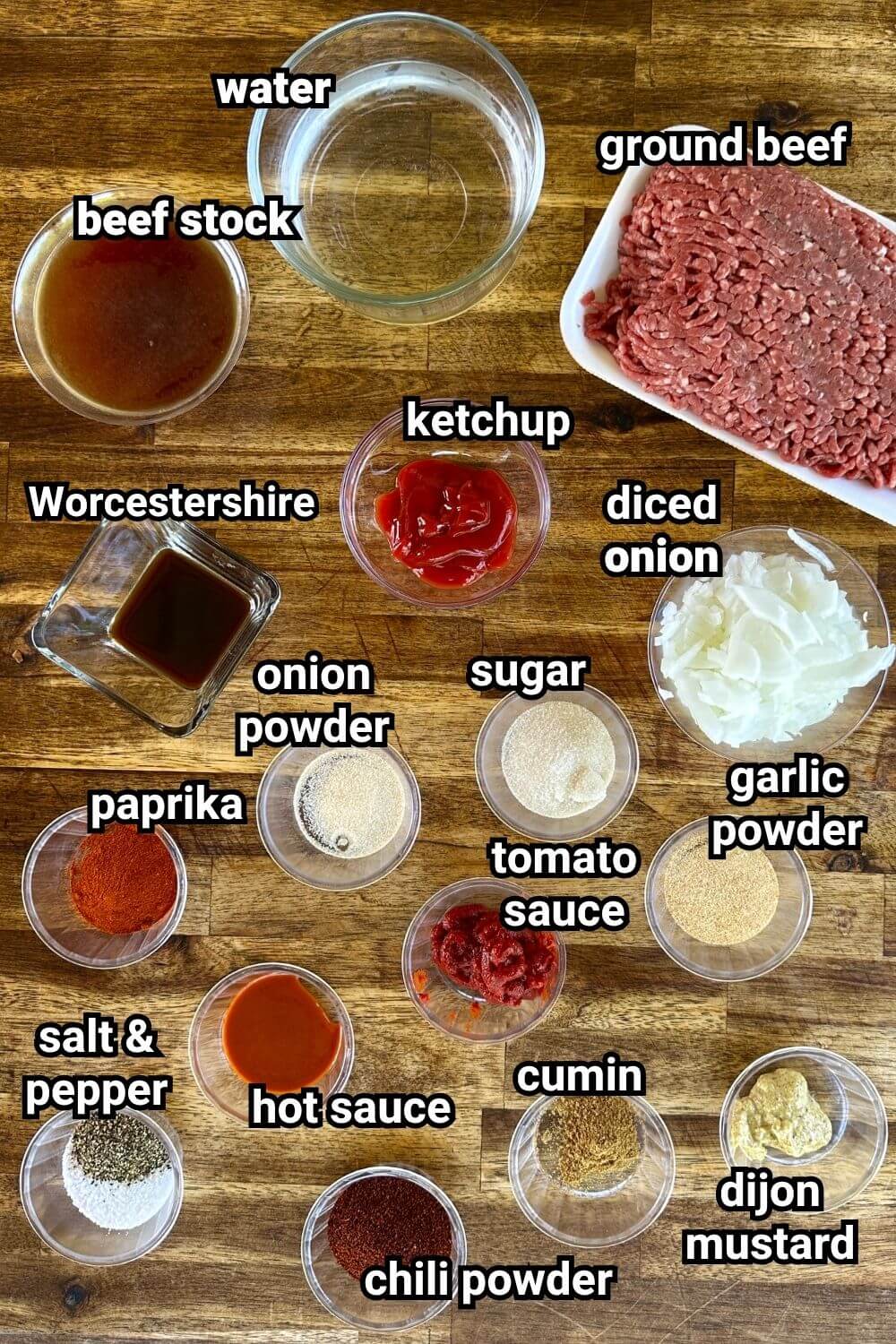 ingredients for hot dog chili that have been measured out in individual bowls