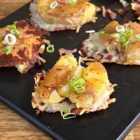 smashed potatoes with parmesan cheese and sliced green onions